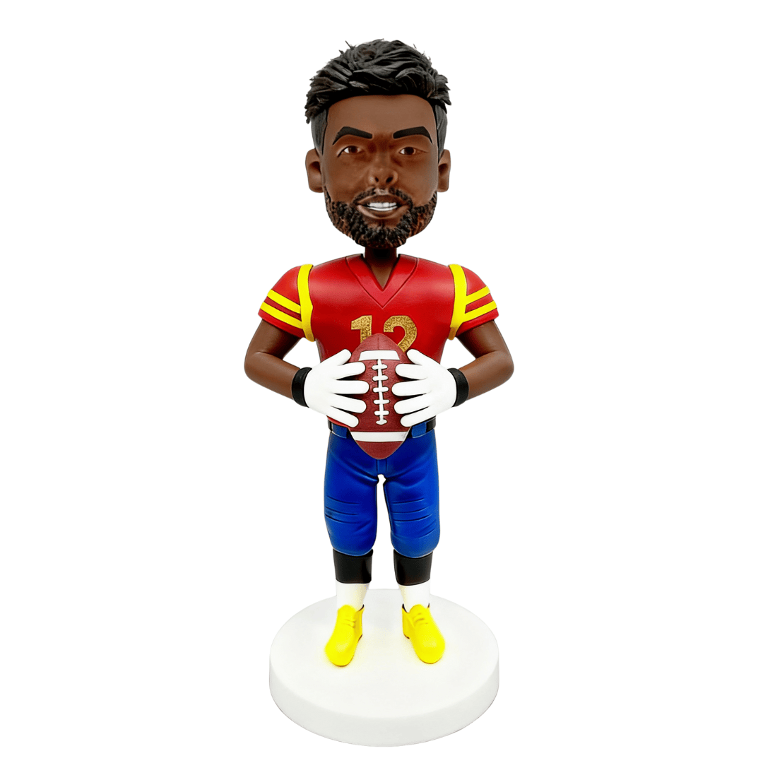 Bobblehead figure of a football player in a red and blue uniform holding a football on a white background